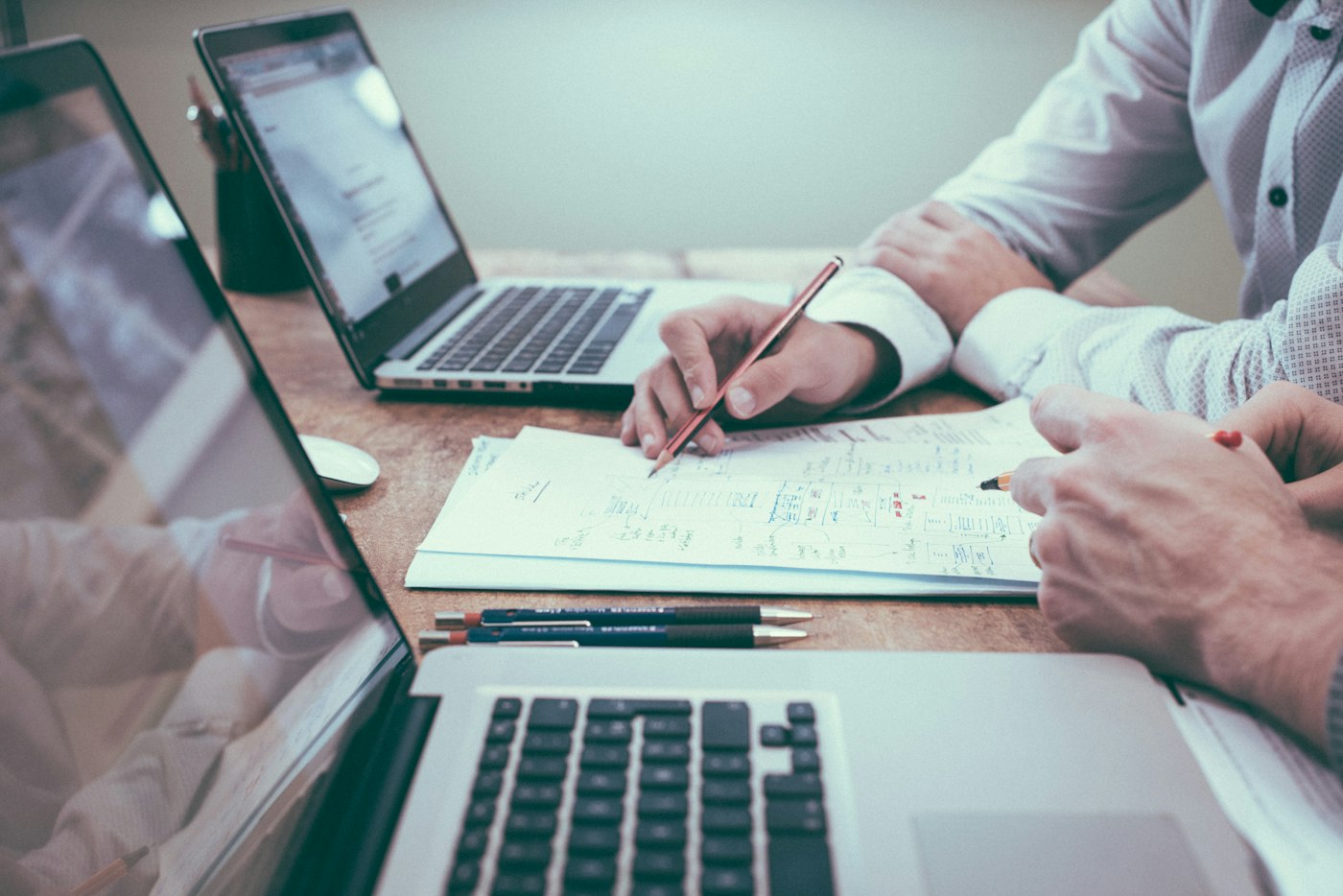 People working together over notes and business plans